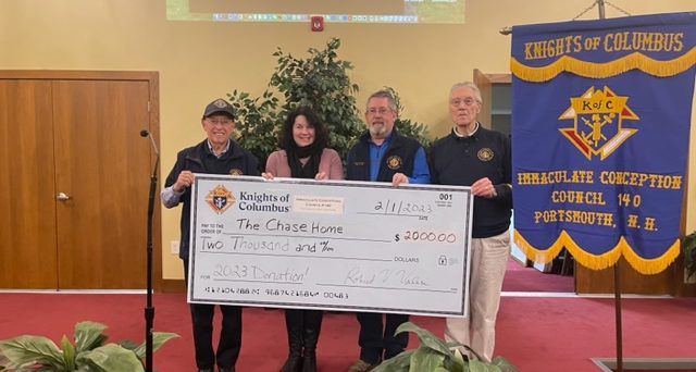Pictured left to right in the photo is Knights of Columbus's Gil Tavares, The Chase Home's Meme Wheeler, and the Knights of Columbus's Jonathan McCoy and Dan Denman.